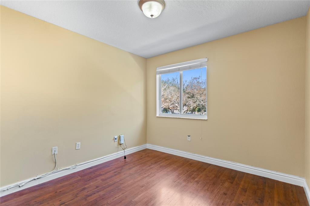 2704 Southwest 128th Avenue Miramar, FL 33027 - Photo 33 of 54 a view of a room with wooden floor and window