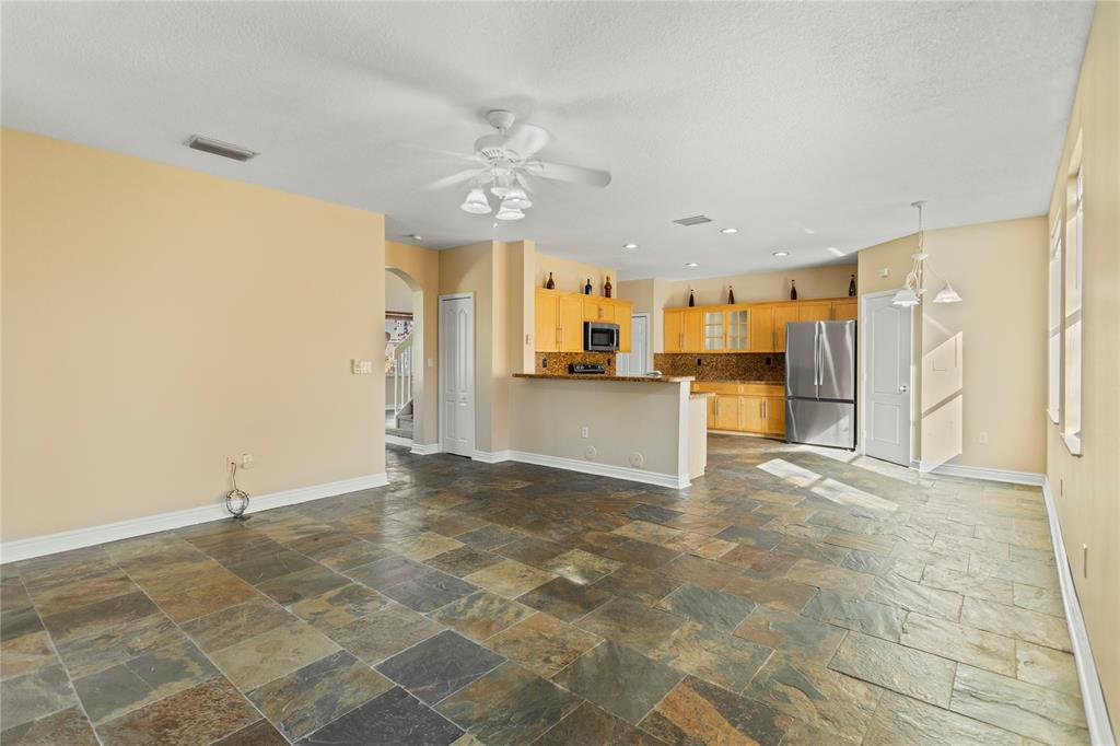 2704 Southwest 128th Avenue Miramar, FL 33027 - Photo 38 of 54 a view of a kitchen with a sink and a refrigerator
