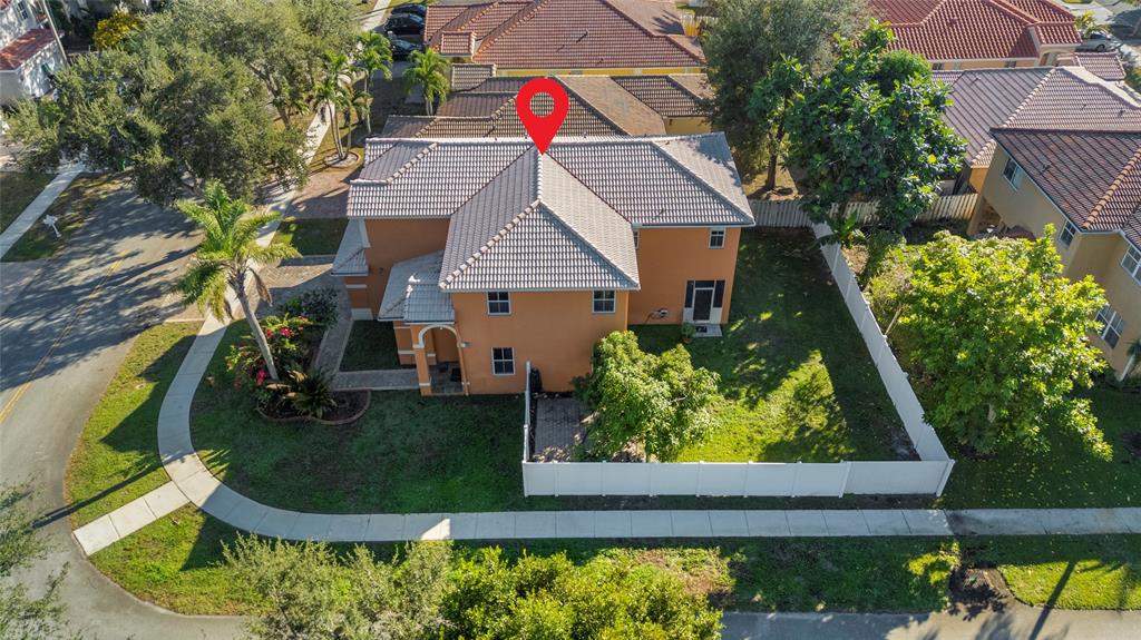 2704 Southwest 128th Avenue Miramar, FL 33027 - Photo 50 of 54 an aerial view of residential house with outdoor space and trees all around