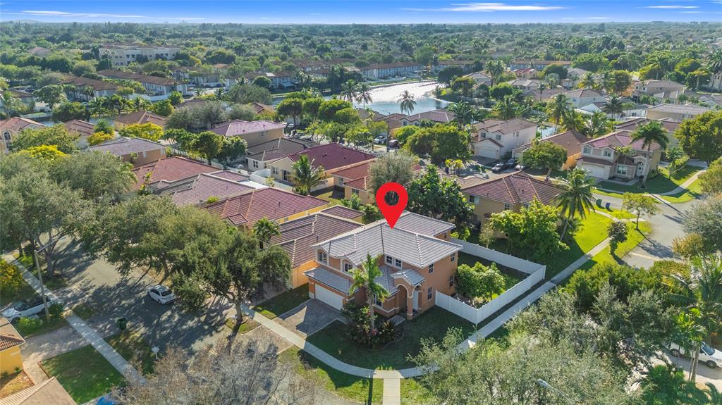 2704 Southwest 128th Avenue Miramar, FL 33027 - Photo 54 of 54 an aerial view of residential houses with outdoor space and trees