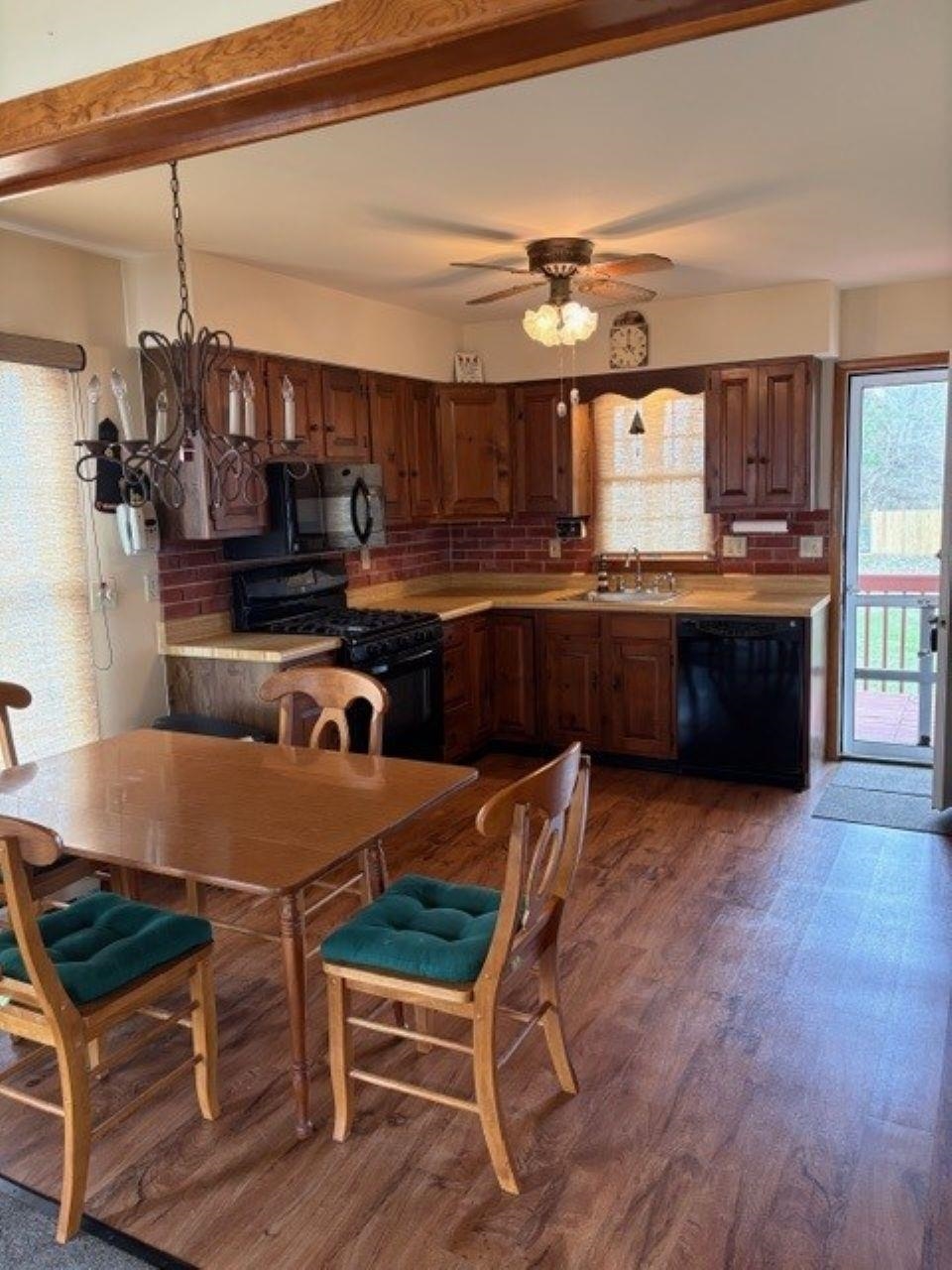 216 2nd Cape May, NJ 08204 - Photo 4 of 16 a kitchen with granite countertop a stove a sink and a refrigerator