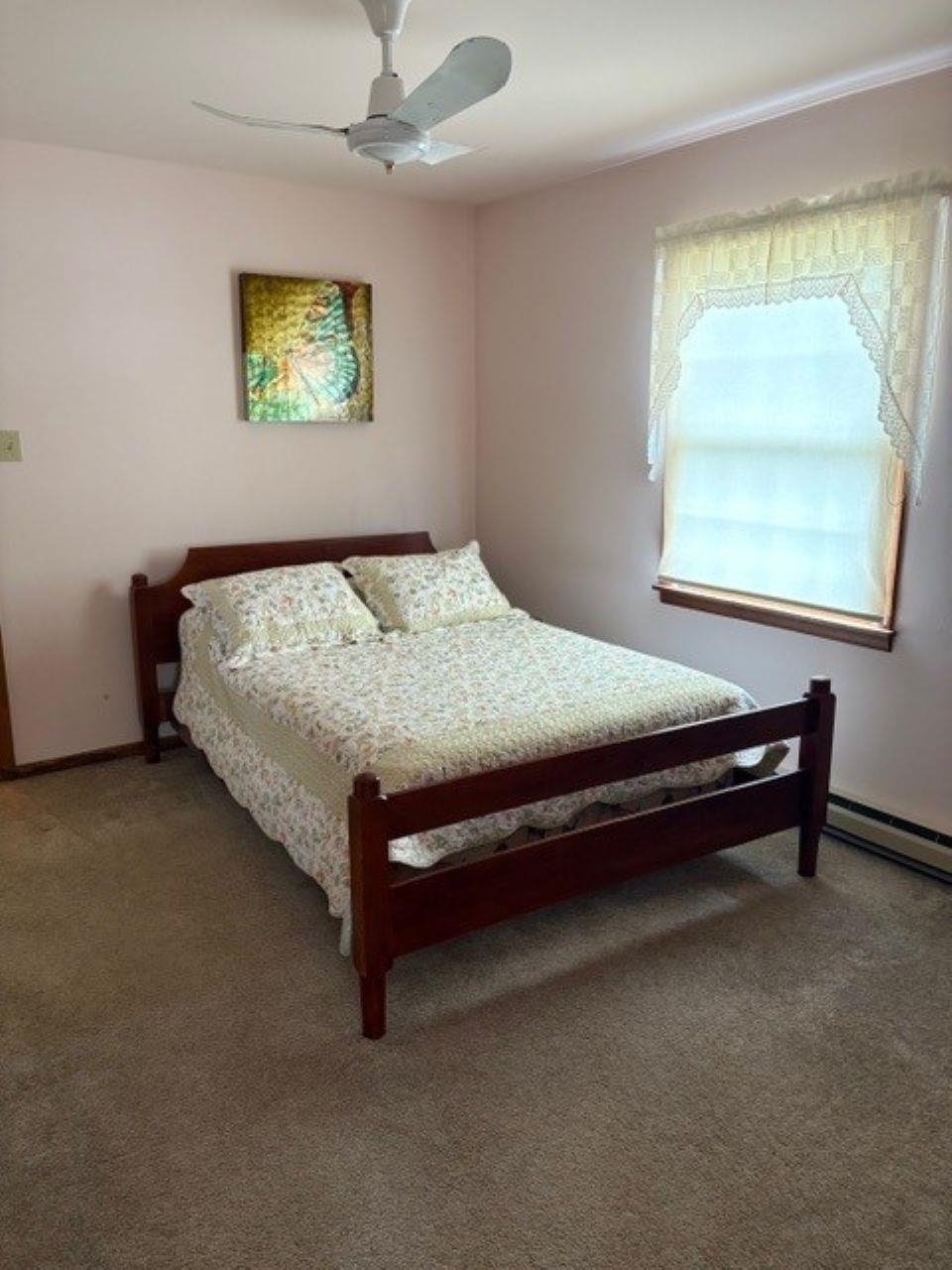 216 2nd Cape May, NJ 08204 - Photo 5 of 16 a bed sitting in a bedroom next to a window