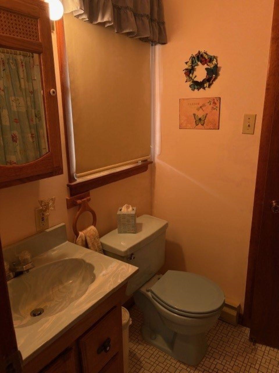 216 2nd Cape May, NJ 08204 - Photo 8 of 16 a bathroom with a sink and a toilet