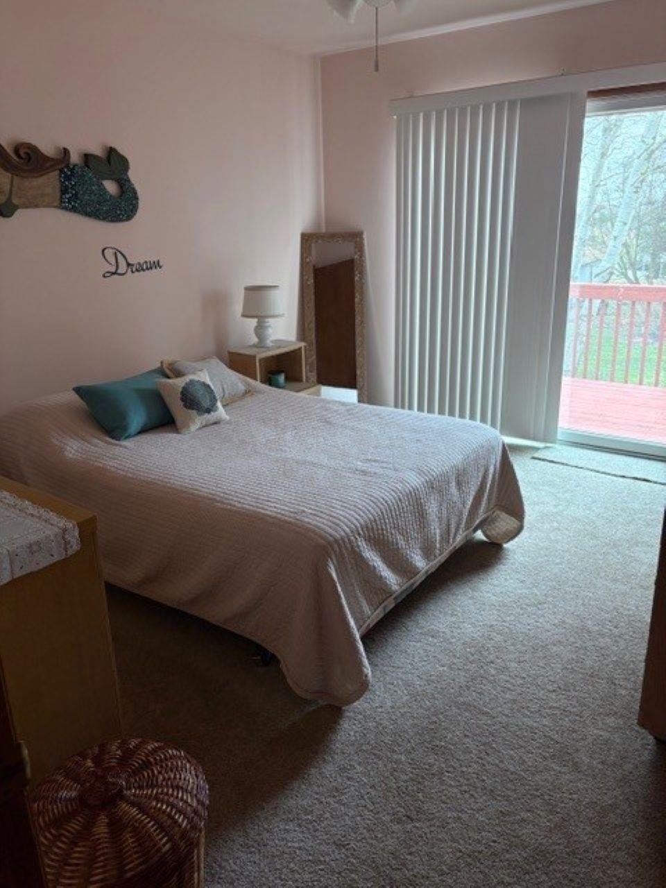 216 2nd Cape May, NJ 08204 - Photo 9 of 16 a bedroom with a bed and a window
