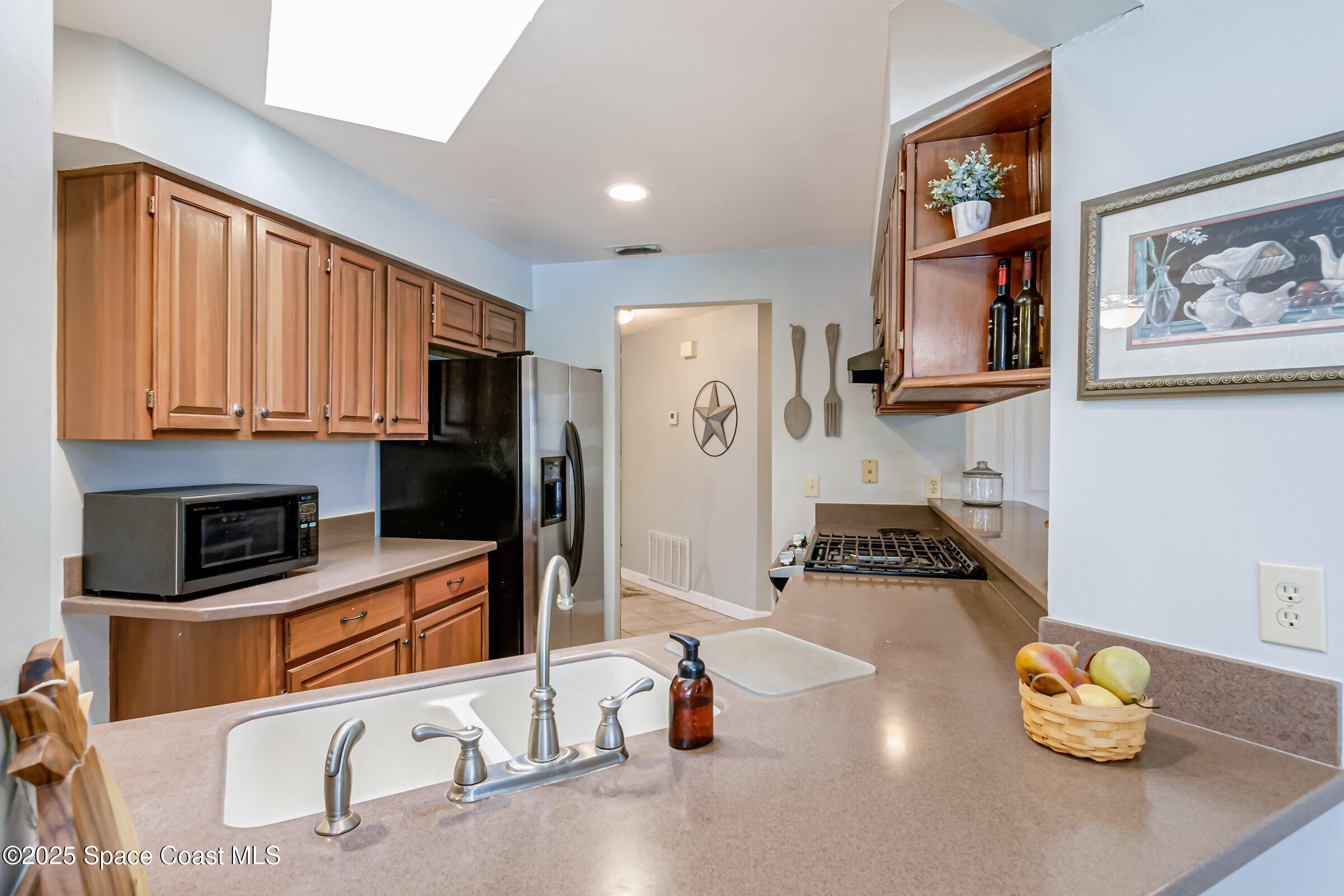 4351 Silver Lake Drive Melbourne, FL 32901 - Photo 17 of 55 a room with furniture and a wooden floor