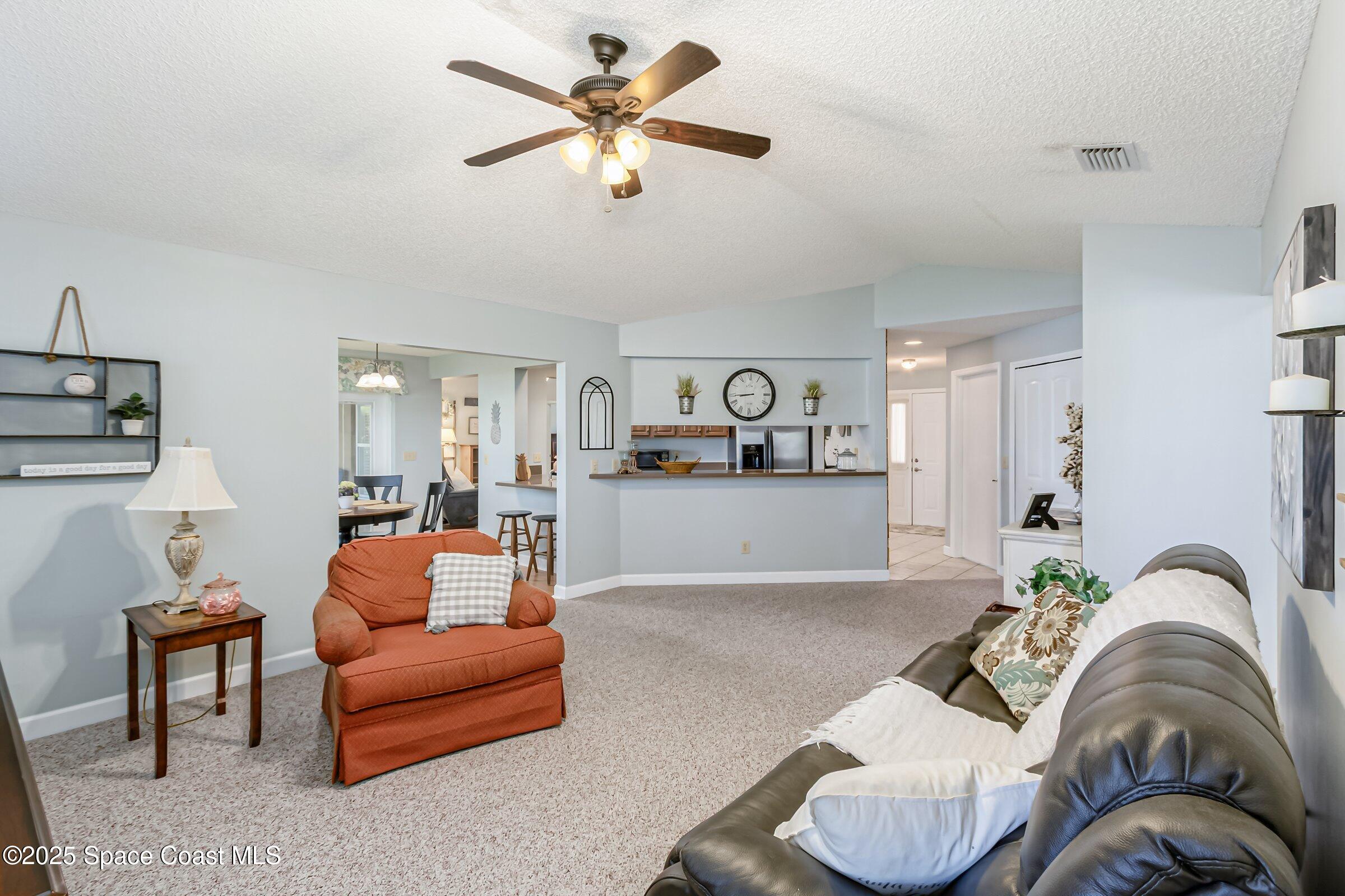 4351 Silver Lake Drive Melbourne, FL 32901 - Photo 26 of 55 a living room with furniture flowerpot and window