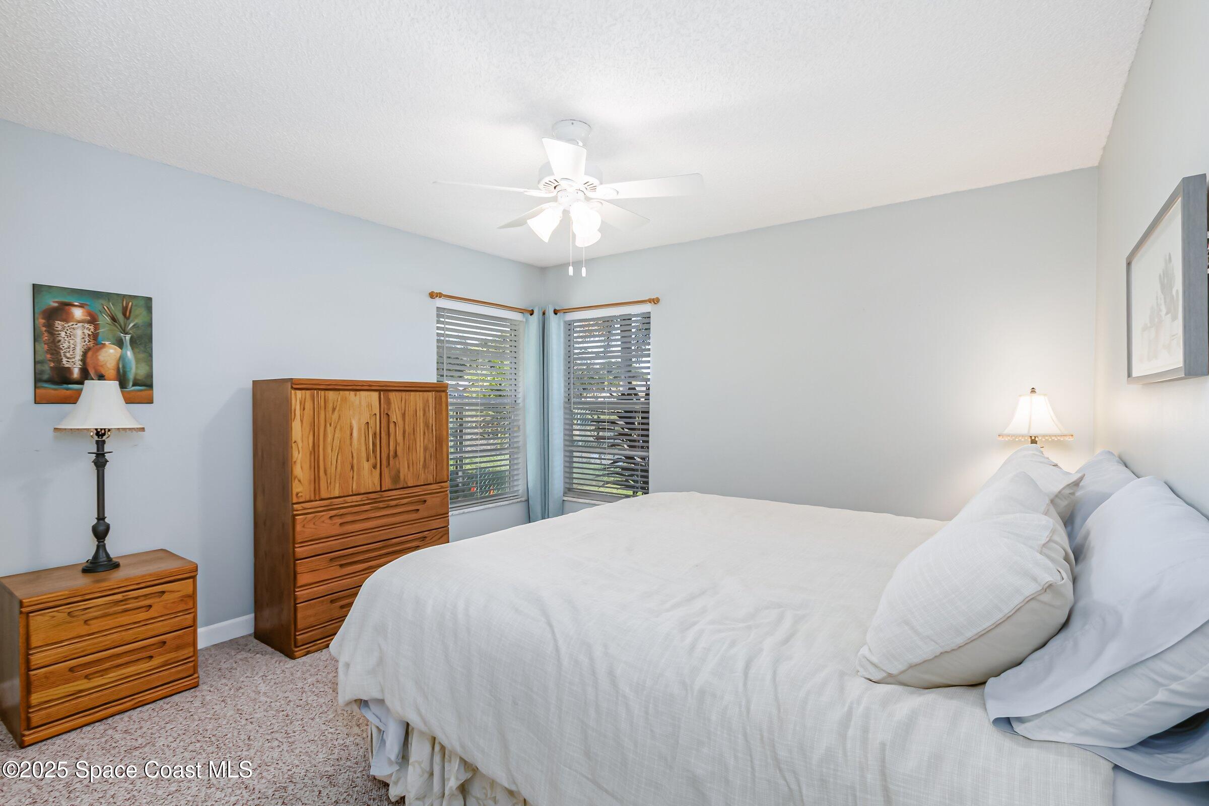 4351 Silver Lake Drive Melbourne, FL 32901 - Photo 28 of 55 a bedroom with a bed and a closet