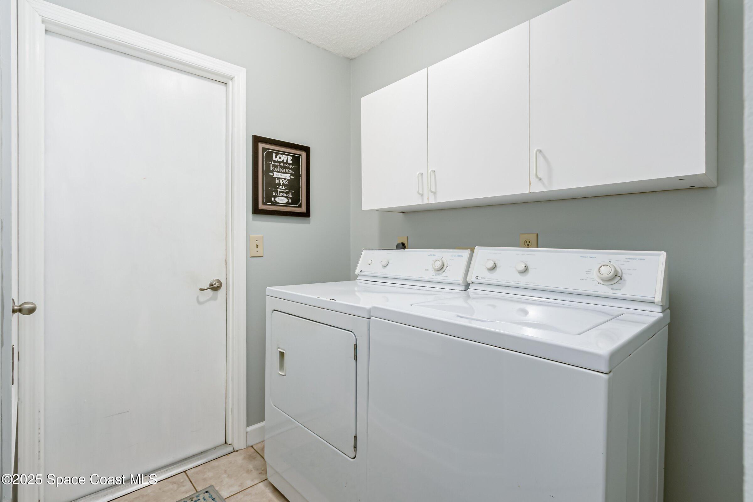 4351 Silver Lake Drive Melbourne, FL 32901 - Photo 31 of 55 a utility room with dryer and washer