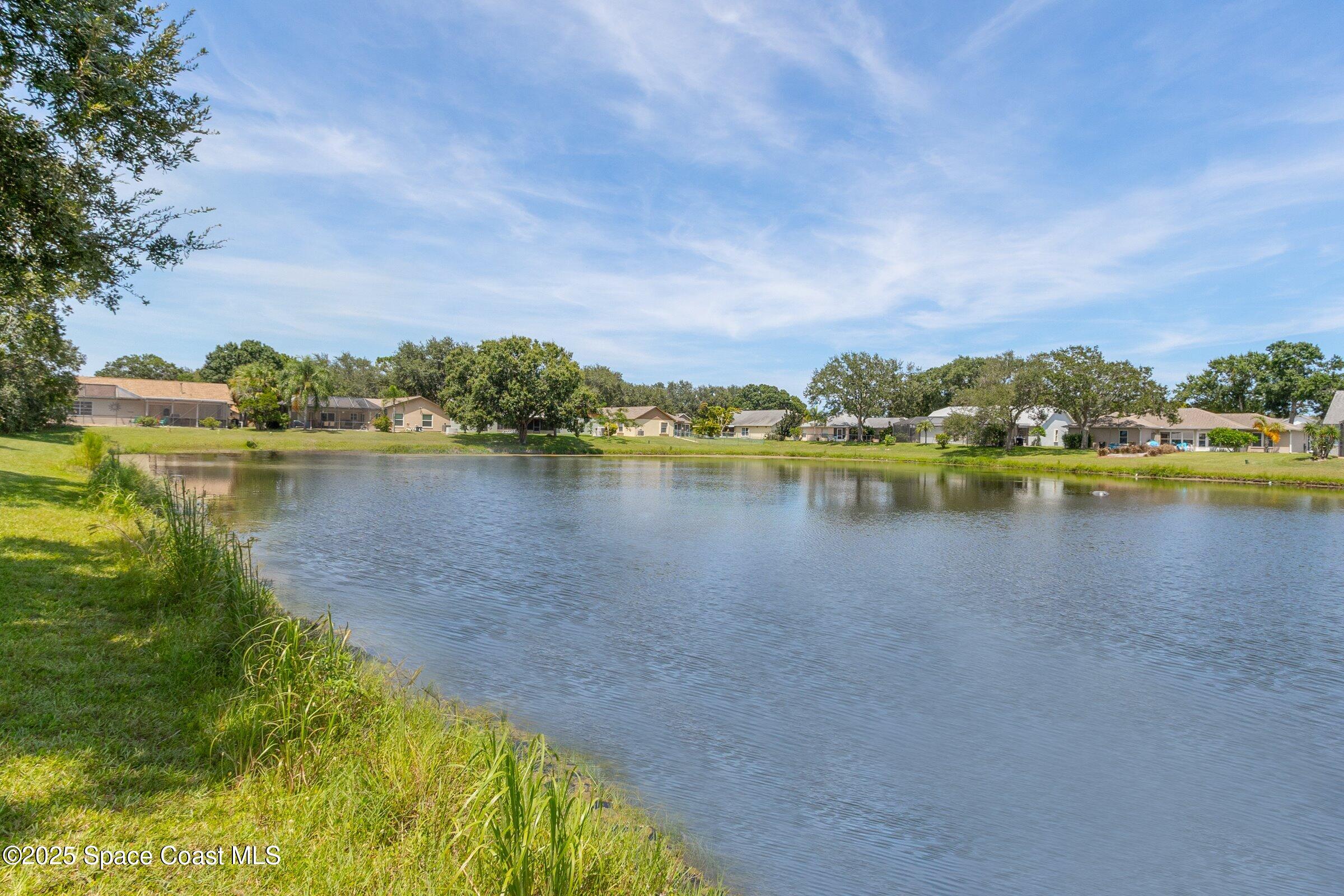 4351 Silver Lake Drive Melbourne, FL 32901 - Photo 39 of 55 a view of a lake with houses in the back