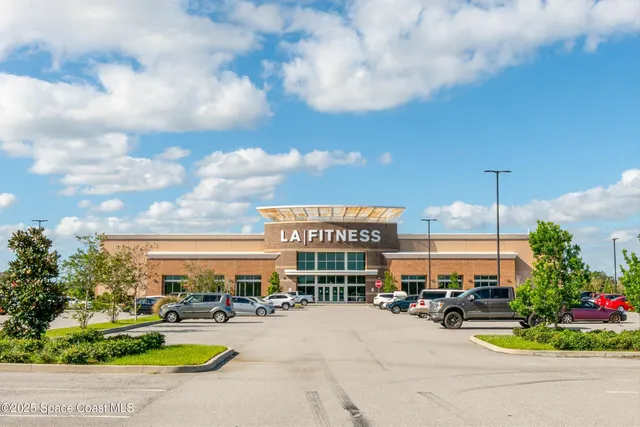 a view of a brick building next to a road