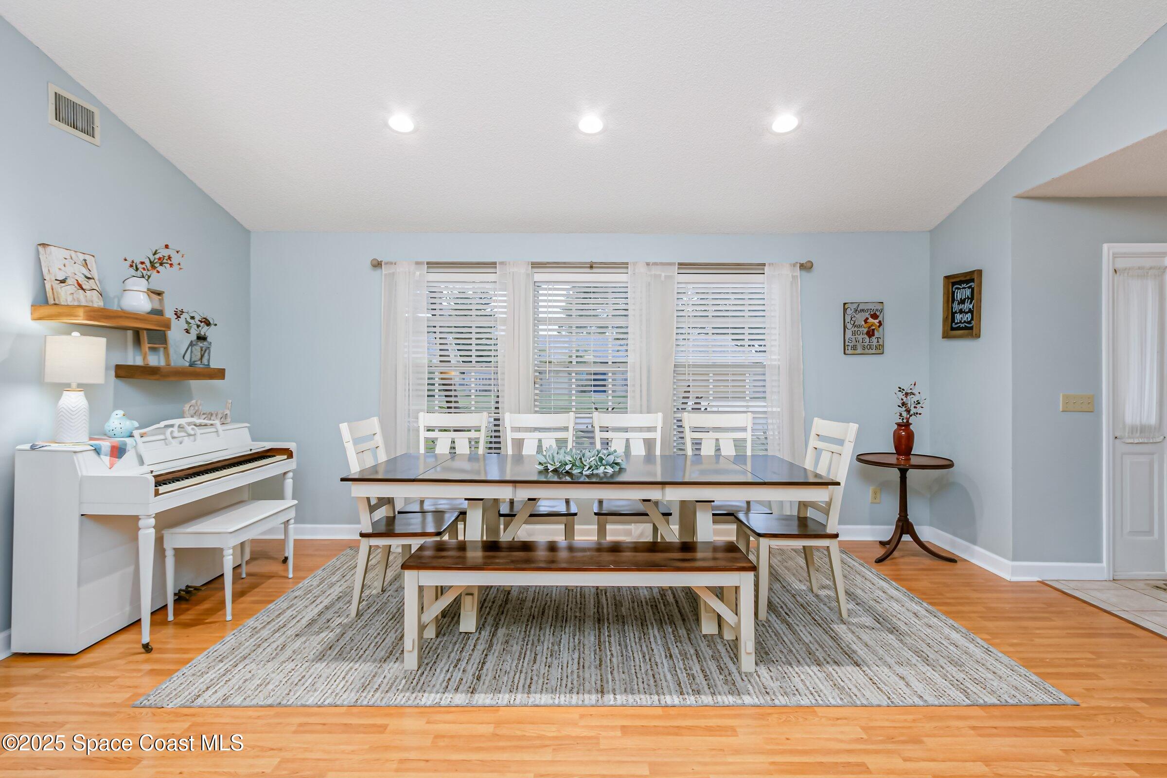 4351 Silver Lake Drive Melbourne, FL 32901 - Photo 8 of 55 a living room with furniture wooden floor and a table