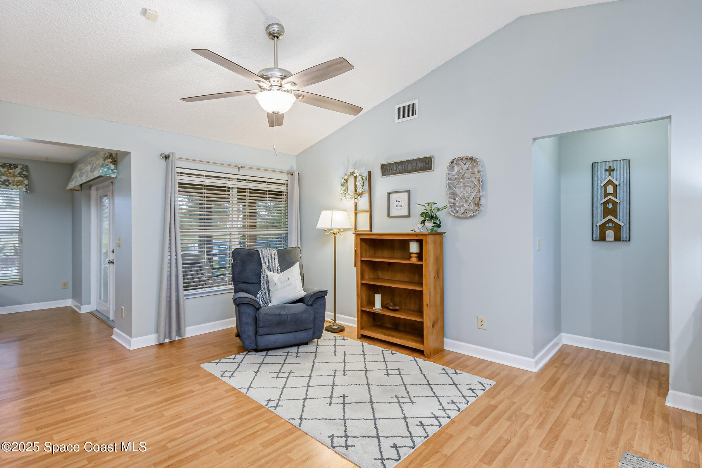 4351 Silver Lake Drive Melbourne, FL 32901 - Photo 9 of 55 a bedroom with a bed and a chandelier