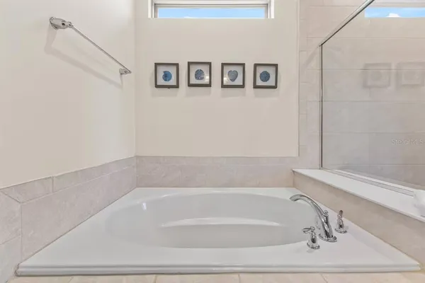 a bathroom with bathtub and shower
