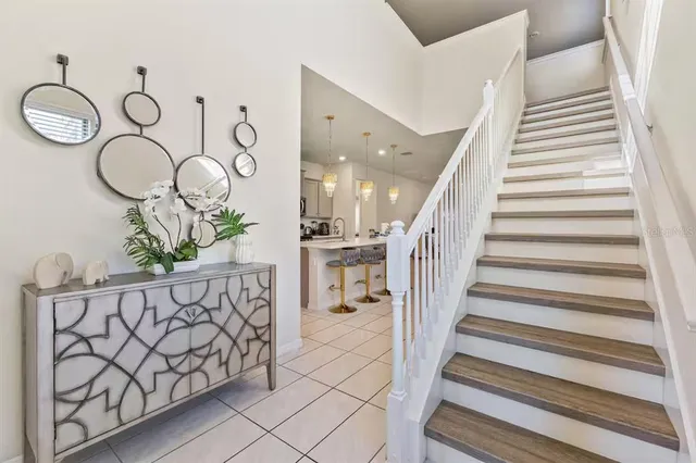 a view of entryway with wooden floor and stairs