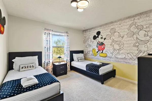 a bedroom with a bed and window