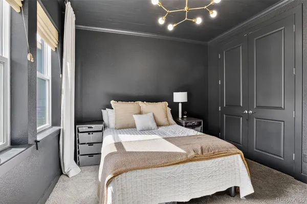 a bedroom with a bed and a walk in closet