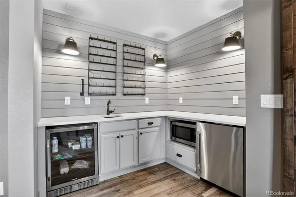 a kitchen with stainless steel appliances granite countertop a sink and cabinets