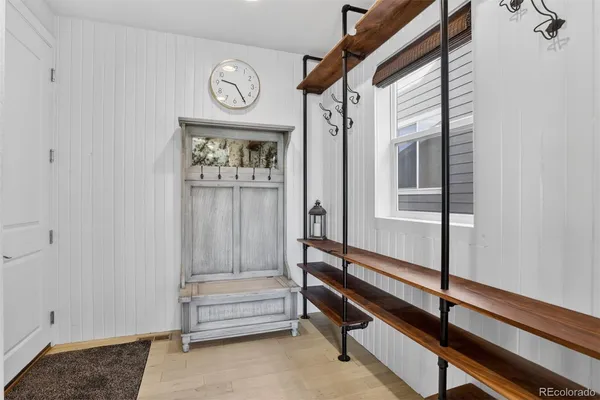 a view of entryway with a window and a chandelier