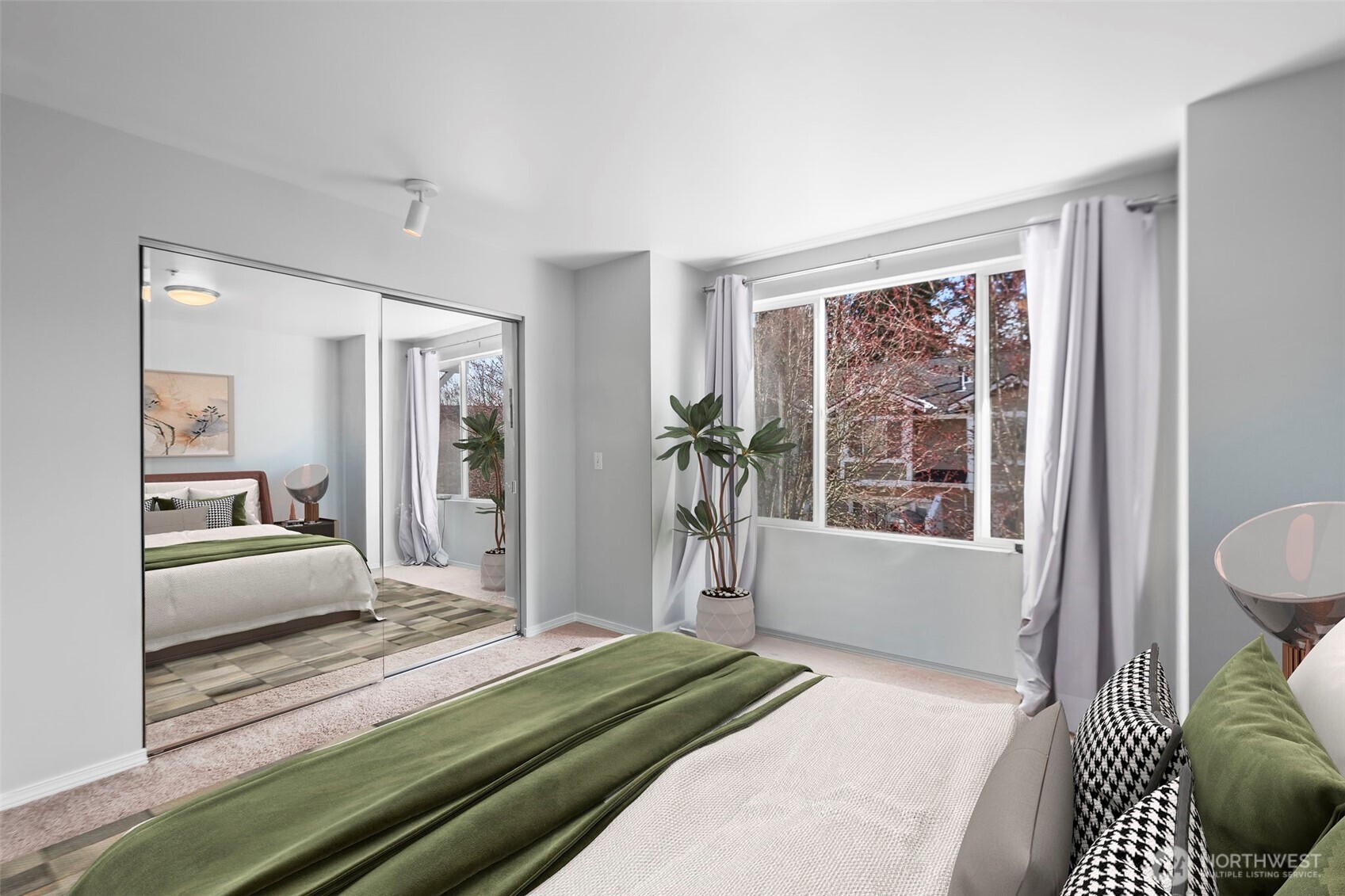 16373 119th Terrace Northeast, Unit 315 Bothell, WA 98011 - Photo 11 of 27 a bedroom with a bed and a large window