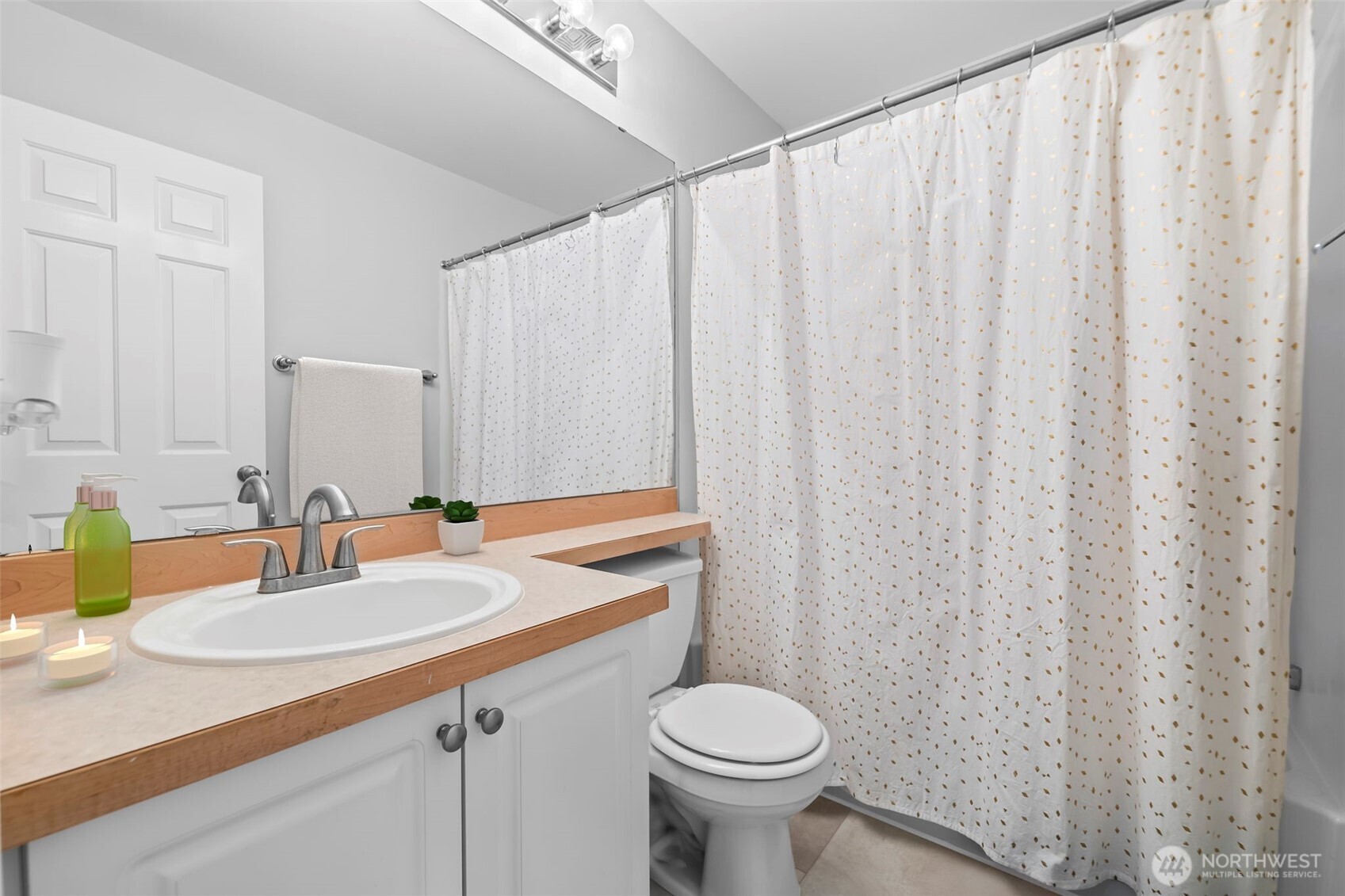 16373 119th Terrace Northeast, Unit 315 Bothell, WA 98011 - Photo 15 of 27 a bathroom with a sink and a mirror