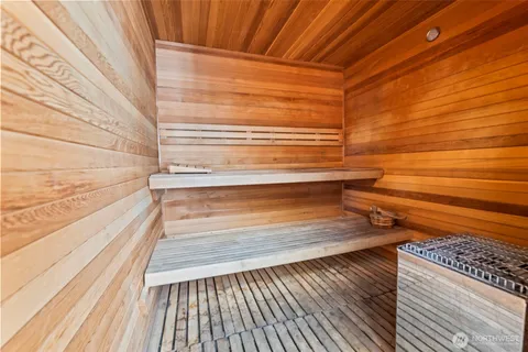 a view of outdoor space with wooden floor and metal railings