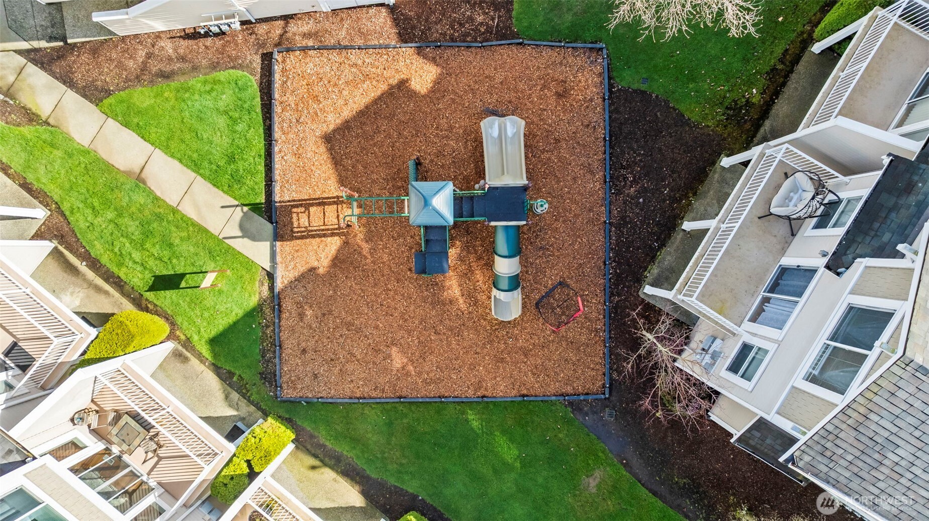16373 119th Terrace Northeast, Unit 315 Bothell, WA 98011 - Photo 24 of 27 an aerial view of a house with a yard and furniture