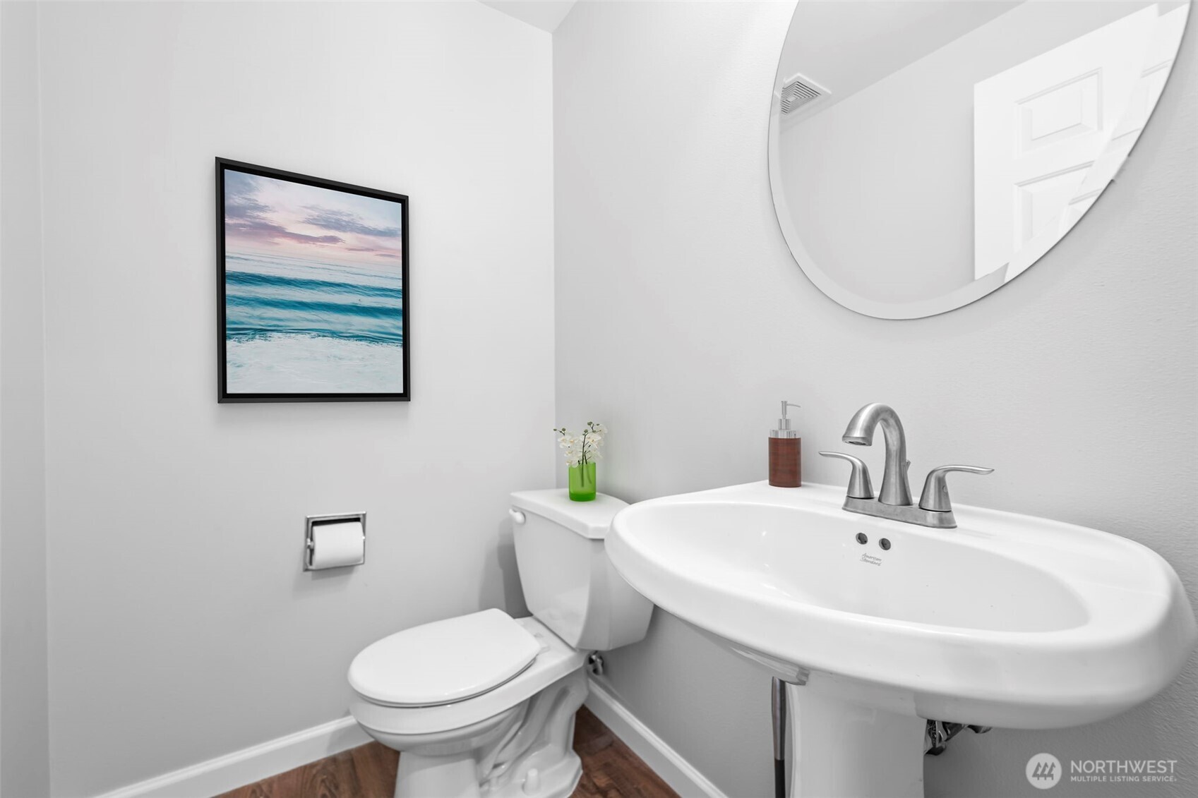 16373 119th Terrace Northeast, Unit 315 Bothell, WA 98011 - Photo 9 of 27 a bathroom with a sink a mirror and a toilet