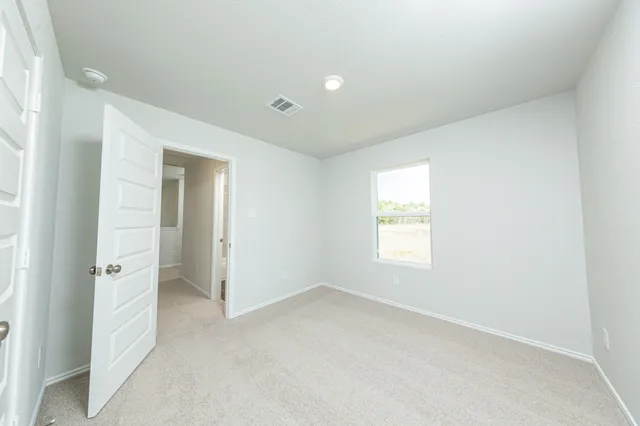a view of an empty room and window