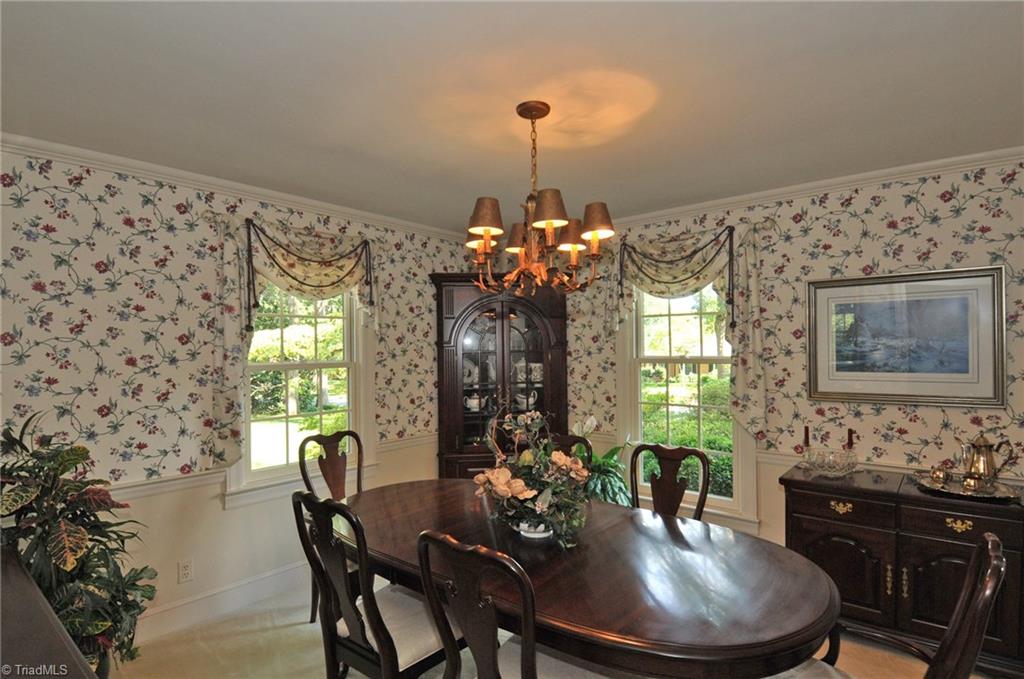 Dining room, hardwoods under carpet.