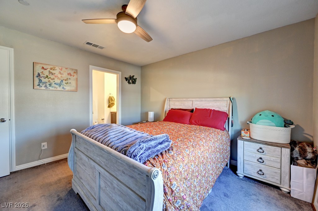 1284 Arcadia Rim Place Henderson, NV 89002 - Photo 13 of 27 Bedroom with carpet floors, ceiling fan, and connected bathroom