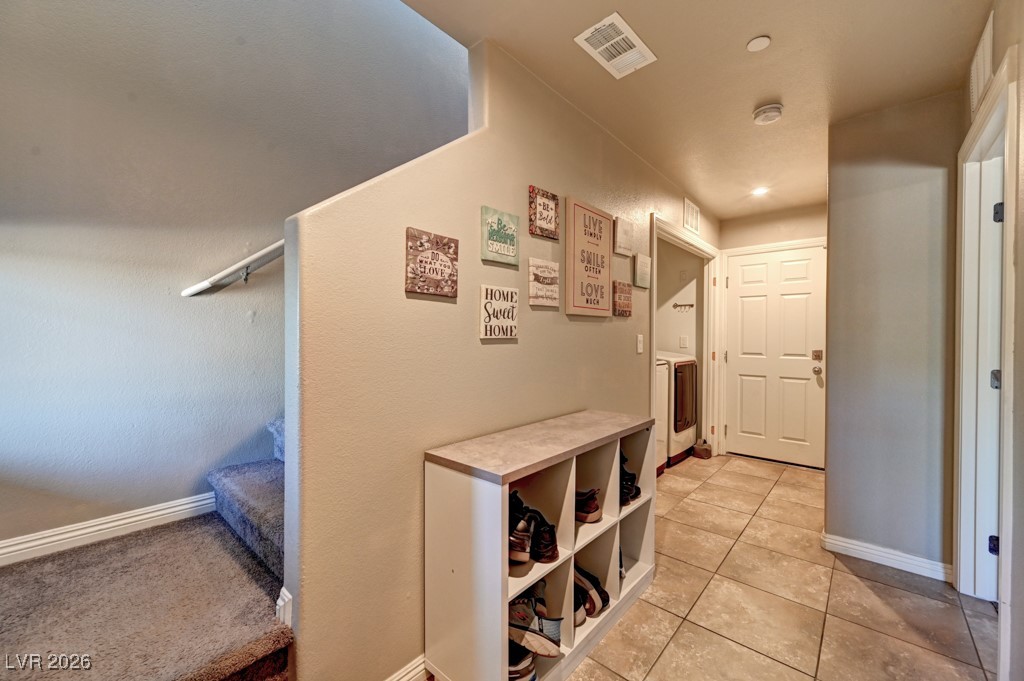1284 Arcadia Rim Place Henderson, NV 89002 - Photo 16 of 27 Corridor featuring baseboards and light tile patterned flooring