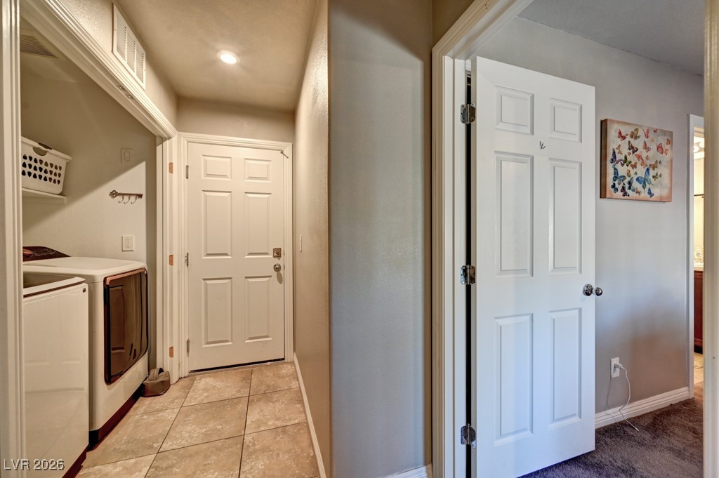 1284 Arcadia Rim Place Henderson, NV 89002 - Photo 18 of 27 Laundry area with independent washer and dryer and light tile patterned floors