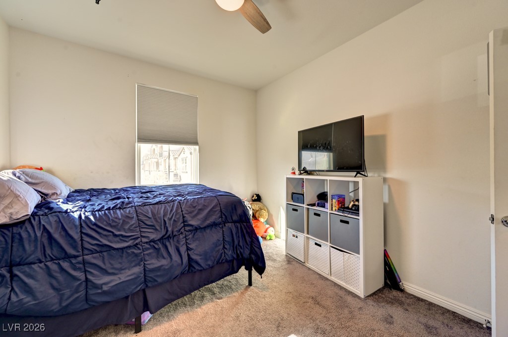 1284 Arcadia Rim Place Henderson, NV 89002 - Photo 22 of 27 Carpeted bedroom featuring ceiling fan