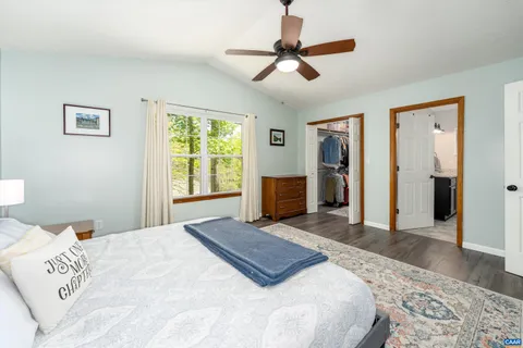 a bedroom with a large bed and a window