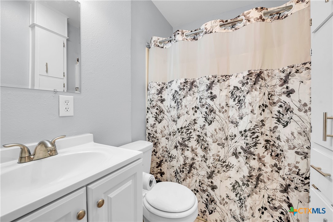 2918 Antelope Trail Temple, TX 76504 - Photo 12 of 24 a bathroom with a sink toilet and shower