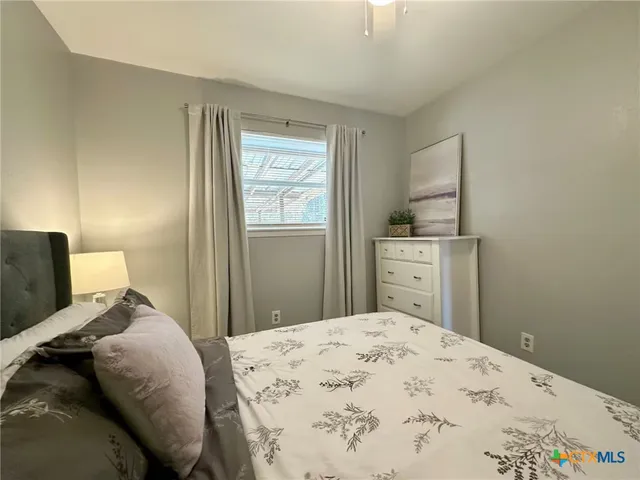 a bedroom with a bed and a cabinets