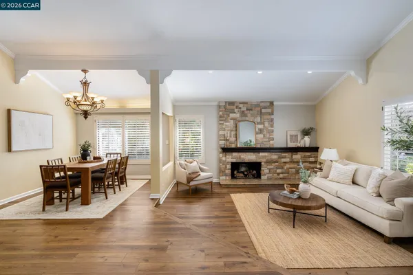 a view of a dining room with furniture window and wooden floor