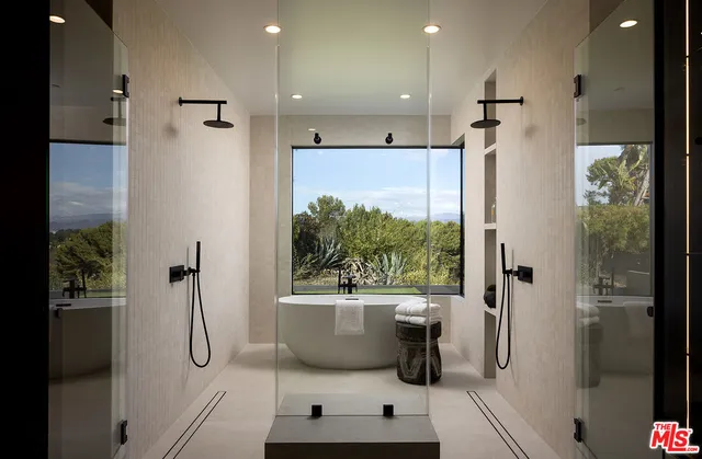 a bathroom with a shower and a sink