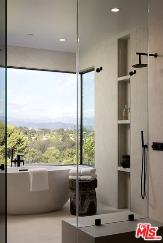a living room with stainless steel appliances kitchen island granite countertop furniture and a view of living room