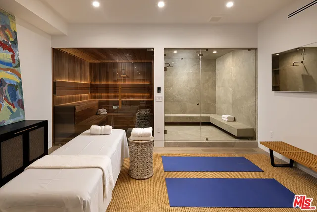 a media room with lots of chairs and a projector screen