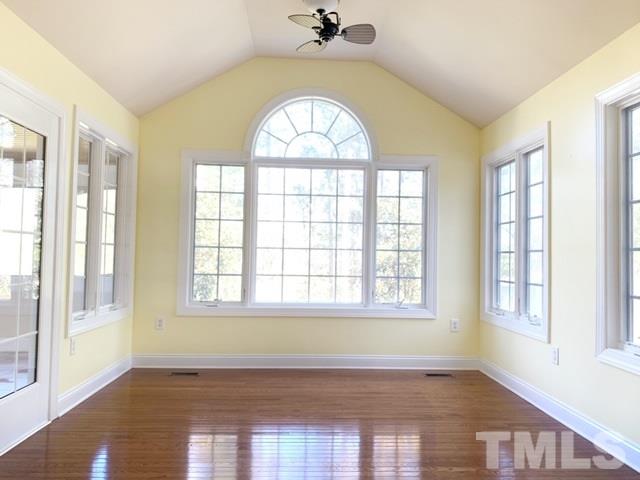 11737 Dellcain Court Raleigh, NC 27617 - Photo 14 of 26 The sunroom exits to the screened in porch, that leads to the exterior super spacious deck for entertaining.