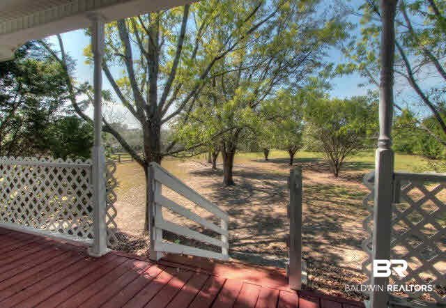 23220 T D Barnett Road Robertsdale, AL 36567 - Photo 4 of 24 front porch