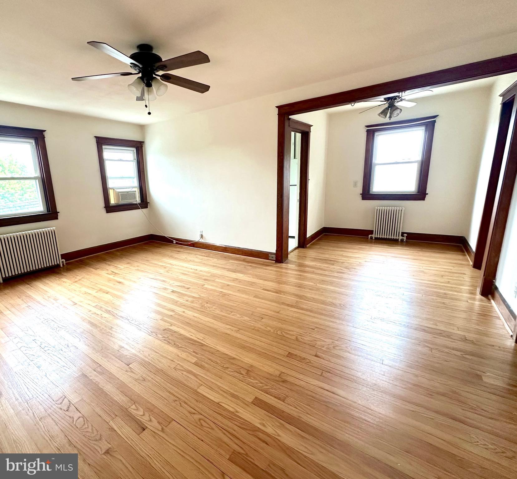8000 Harford Road Parkville, MD 21234 - Photo 5 of 20 a view of a room with wooden floor and window