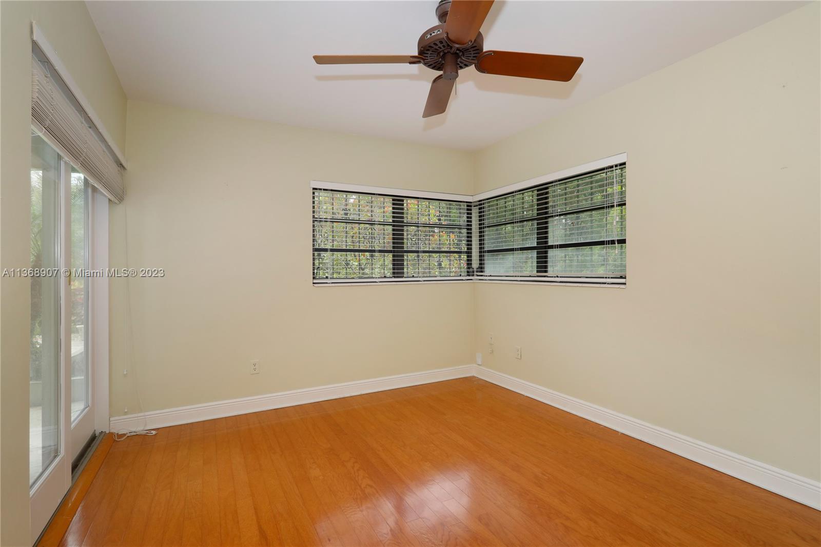 6970 Sunset Drive Miami, FL 33143 - Photo 12 of 30 an empty room with a empty space and a ceiling fan