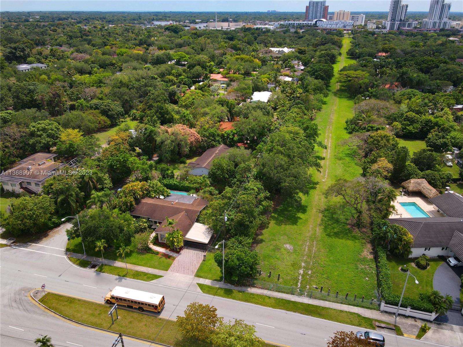 6970 Sunset Drive Miami, FL 33143 - Photo 19 of 30 an aerial view of residential houses with outdoor space and street view
