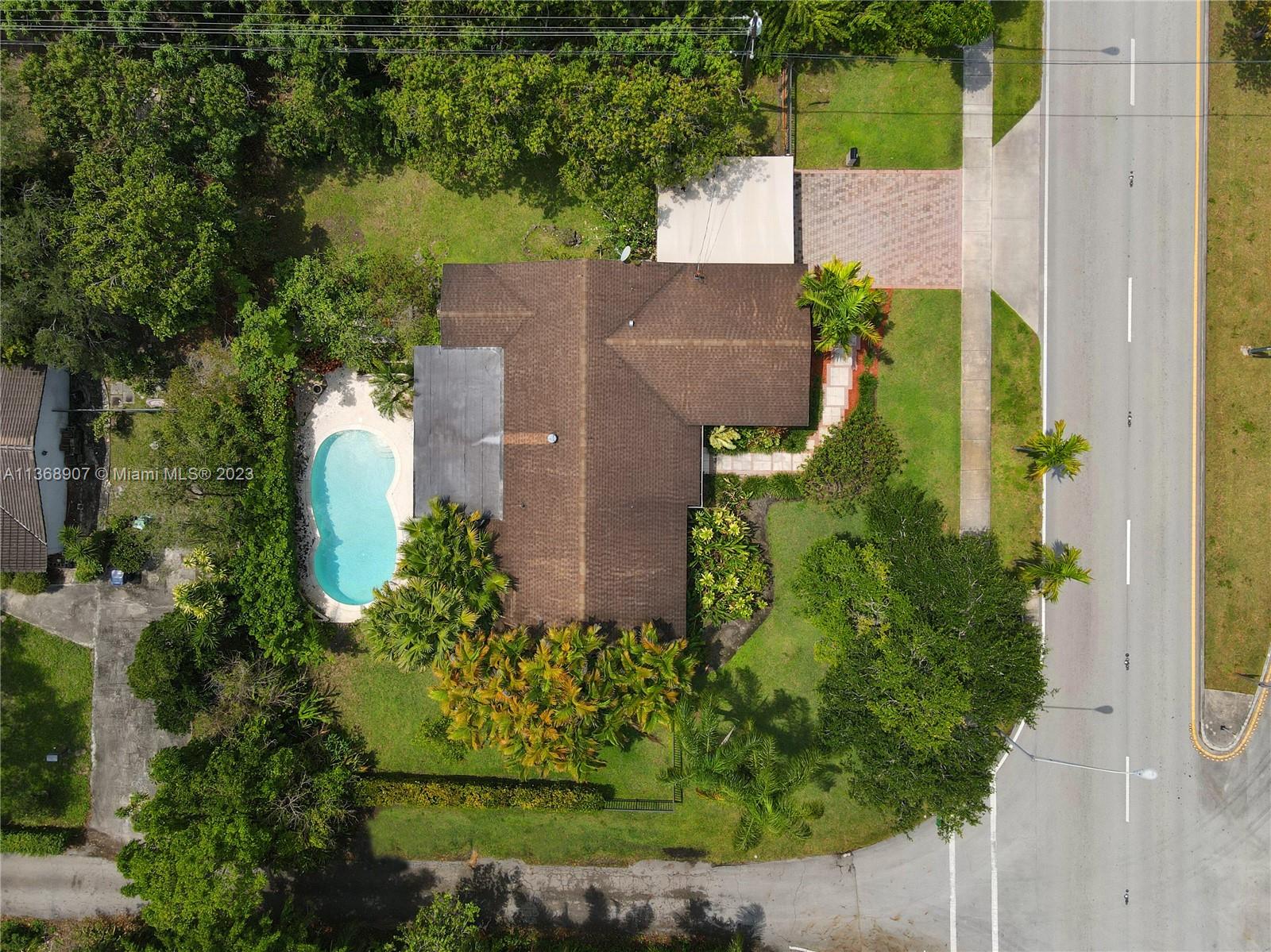 6970 Sunset Drive Miami, FL 33143 - Photo 22 of 30 an aerial view of a house with a garden