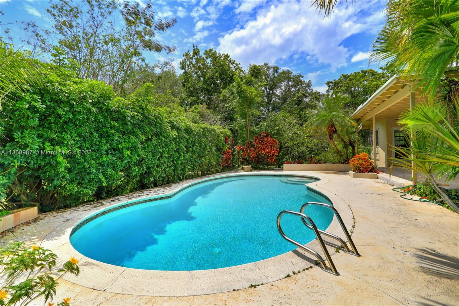 6970 Sunset Drive Miami, FL 33143 - Photo 25 of 30 a view of swimming pool and lounge chair