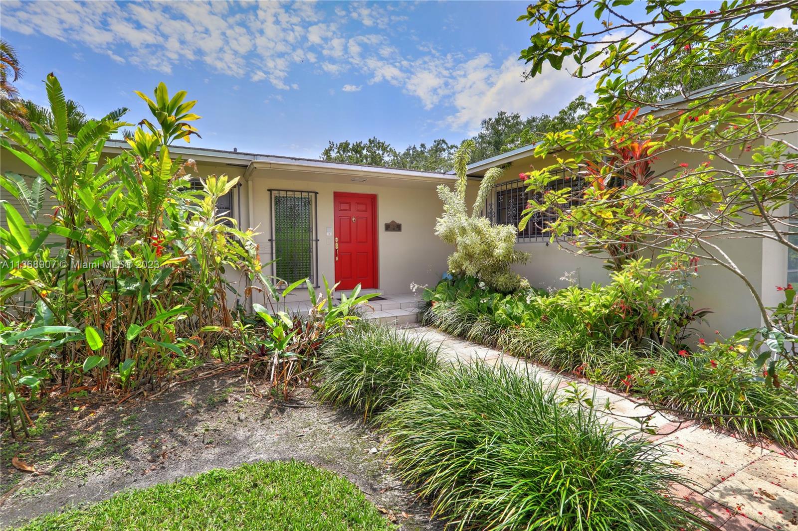6970 Sunset Drive Miami, FL 33143 - Photo 30 of 30 a front view of a house with a yard