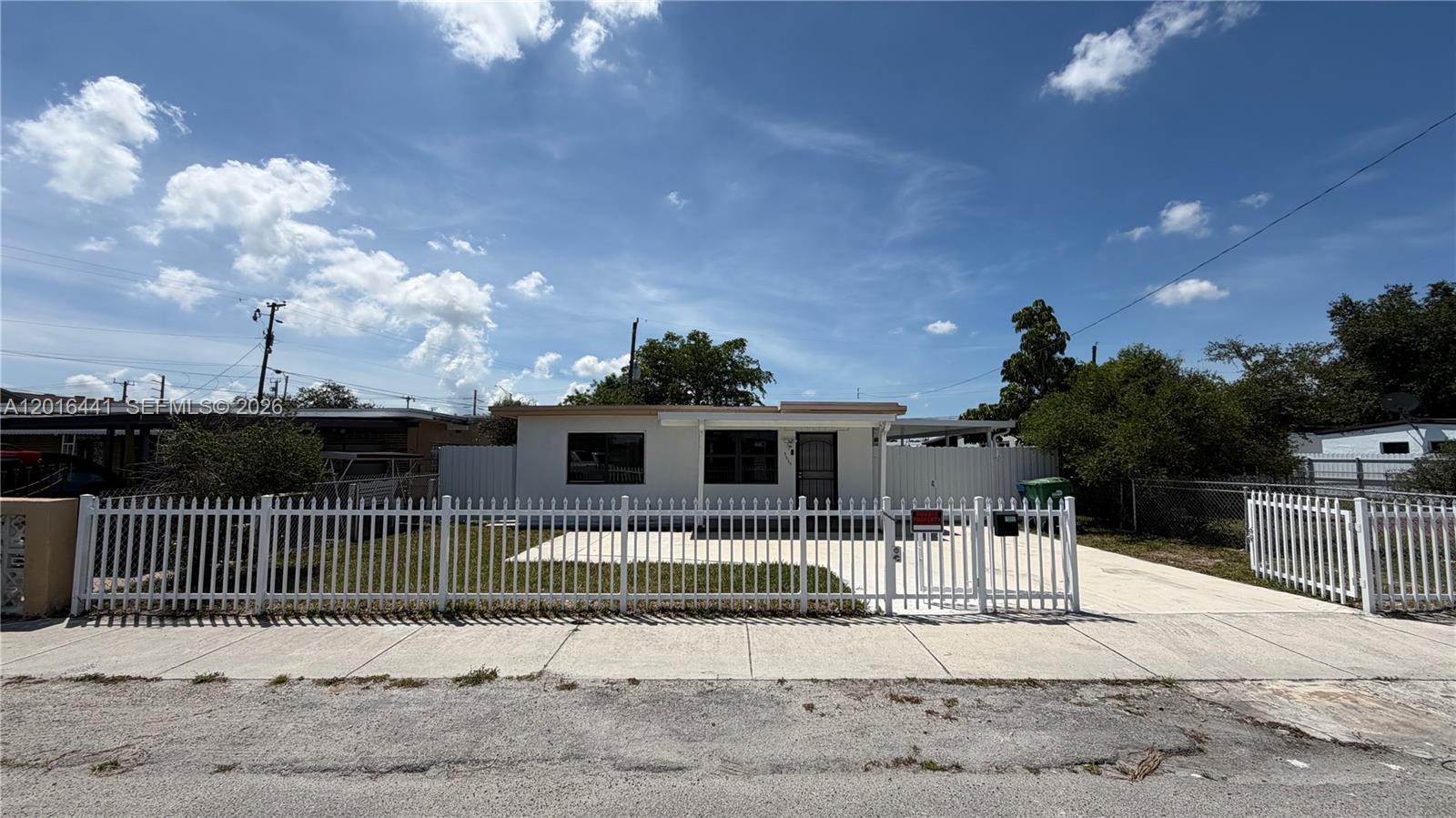 2230 Service Road Opa-Locka, FL 33054 - Photo 1 of 25 a view of a house with a backyard
