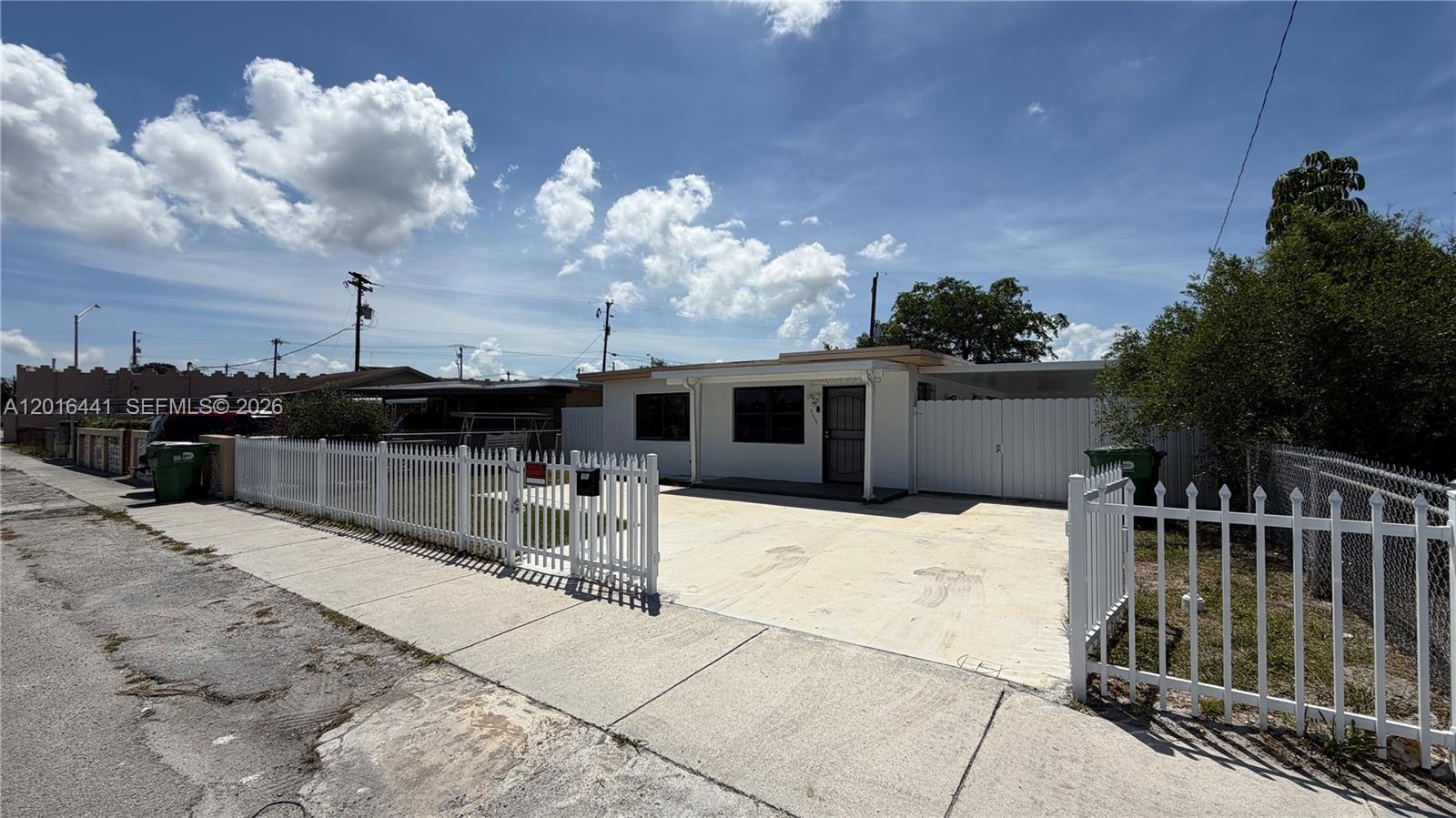 2230 Service Road Opa-Locka, FL 33054 - Photo 2 of 25 a house view with a sitting space